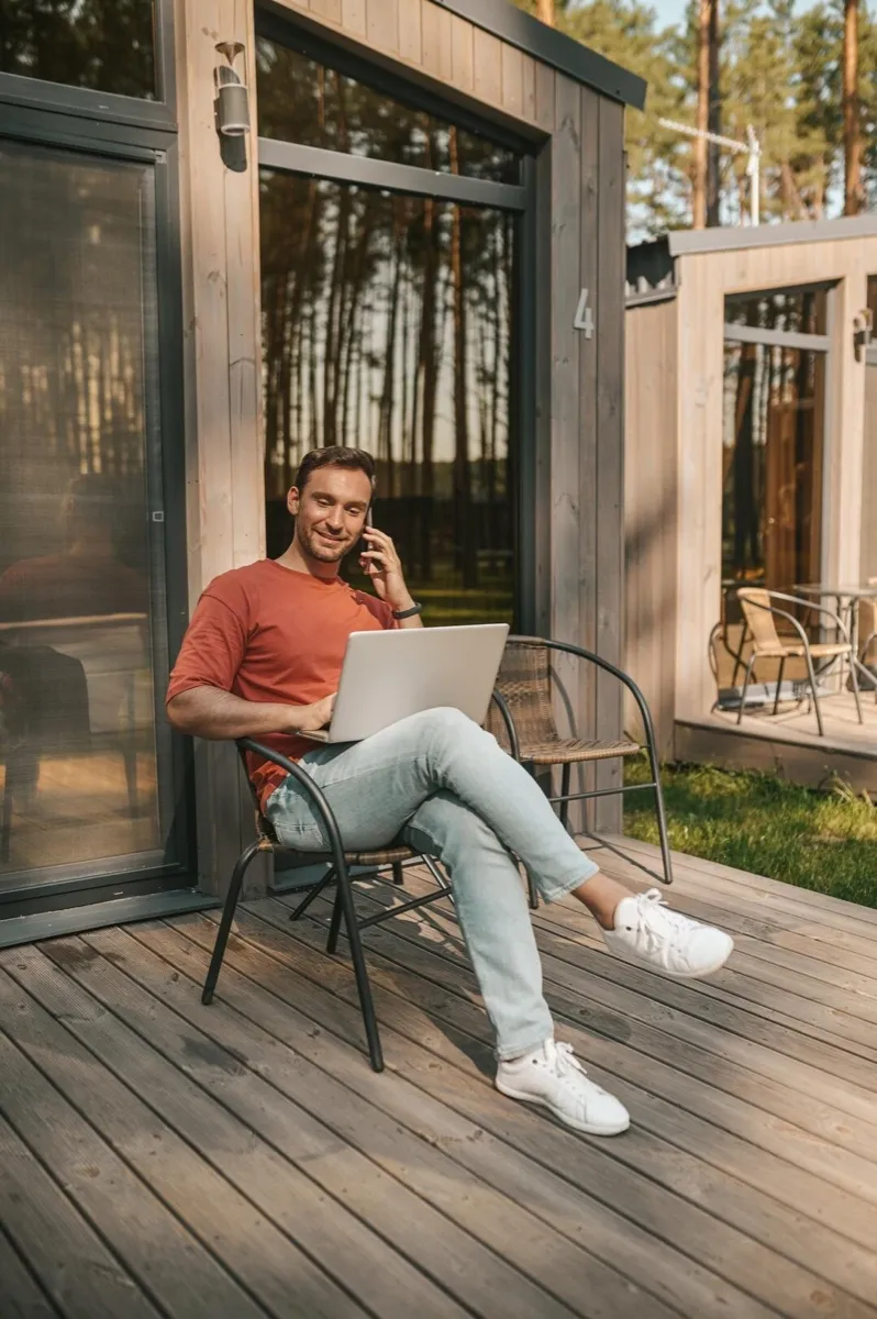 An overseas landlord reviewing their portfolio on a laptop